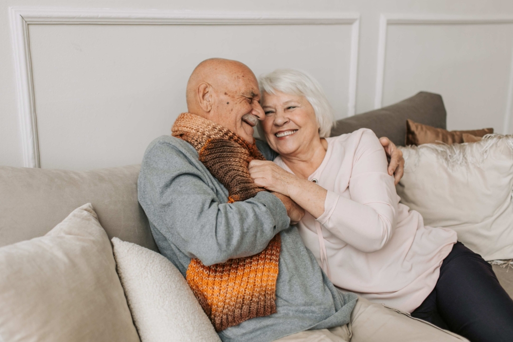 A senior couple enjoying each other's company on the couch | Featured image for the elder lawyers Brisbane page.